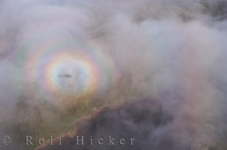 Luftbild Hubschrauber Regenbogen Wolken